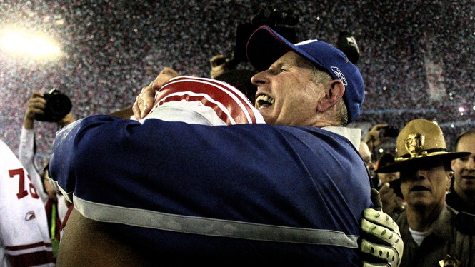 Tom Coughlin hugging a player after Super Bowl win