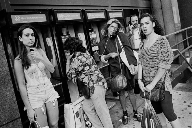 People talking on public phones