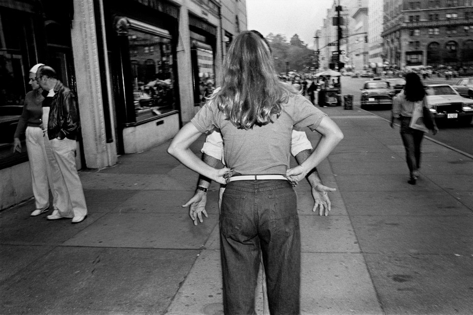 A man and woman argue on the street