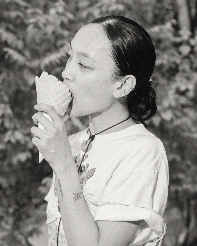 A person eats an ice cream cone