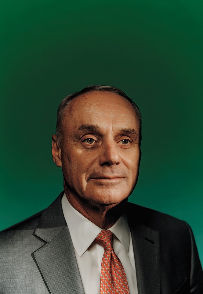 photo of man in suit and tie on green background