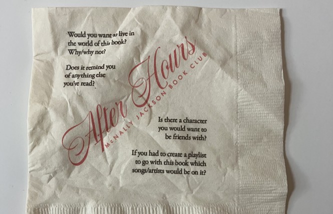 A crinkled napkin from McNally Jackson's After Hours book club. Printed with discussion questions such as "Is there a character you would want to be friends with?"