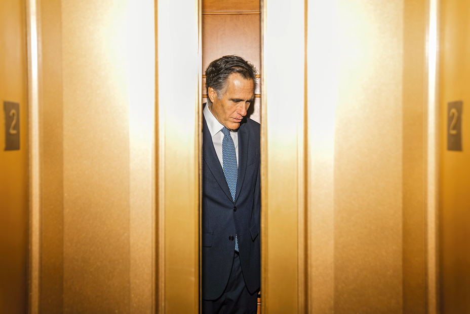 Romney entering an elevator.