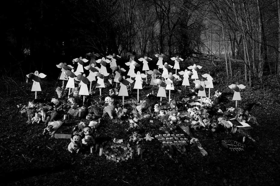 Picture of 7 angel wood cut-outs for the victims of an elementary school shooting in Newtown in Newtown, Connecticut.