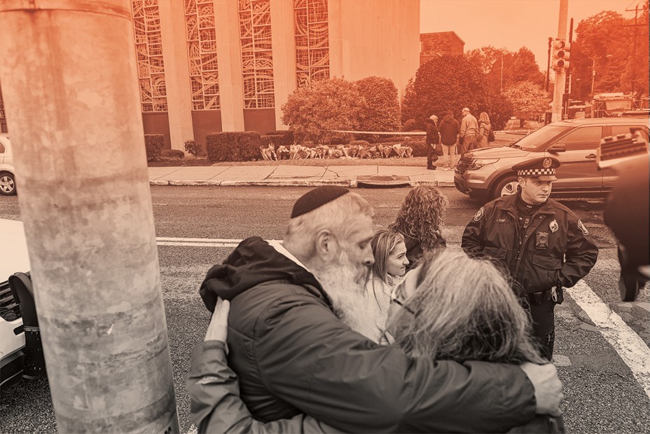 photo of people hugging in street with uniformed police behind