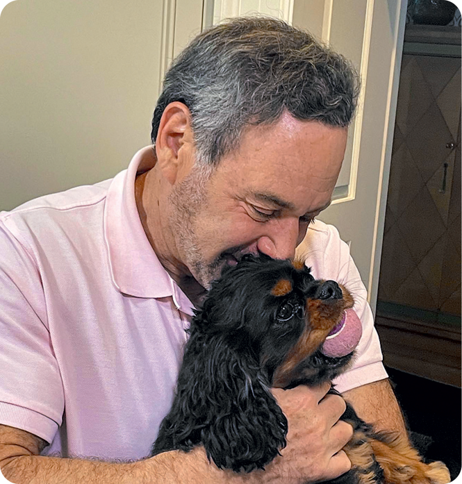 The Author holding Ringo the dog. 