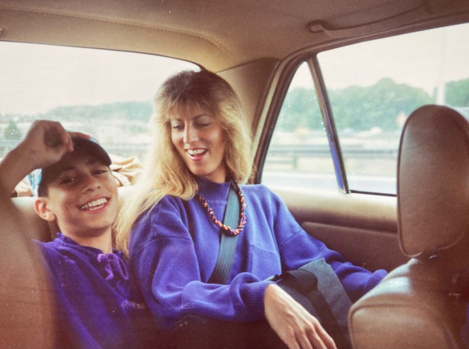 Picture of the author with his aunt at the back of a Mercedes