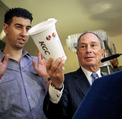 photo of Mayor Bloomberg at podium holding up large soda cup