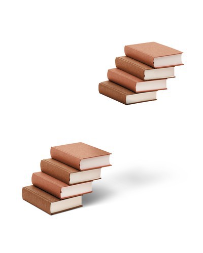 A stack of books with a gap in it