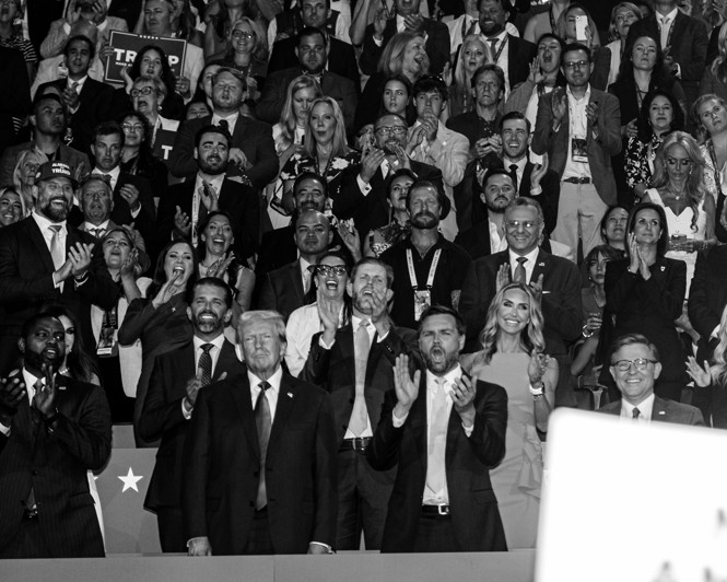 Black-and-white photo of Donald Trump, J. D. Vance, and other Republicans cheering at the RNC