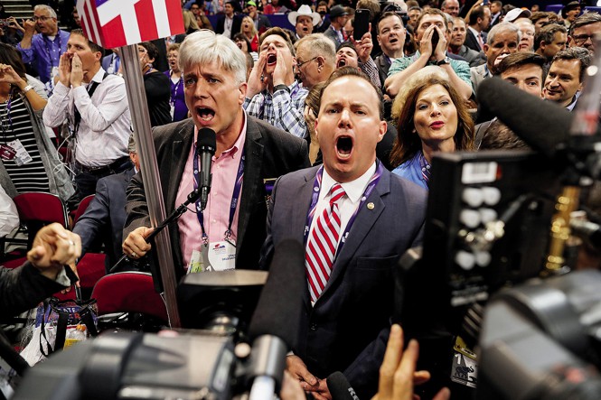 photo of Mike Lee and others at RNC shouting with microphone and cameras in 2016