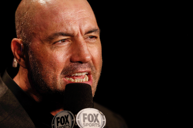 photo of Joe Rogan speaking into microphone with "FOX" on it 