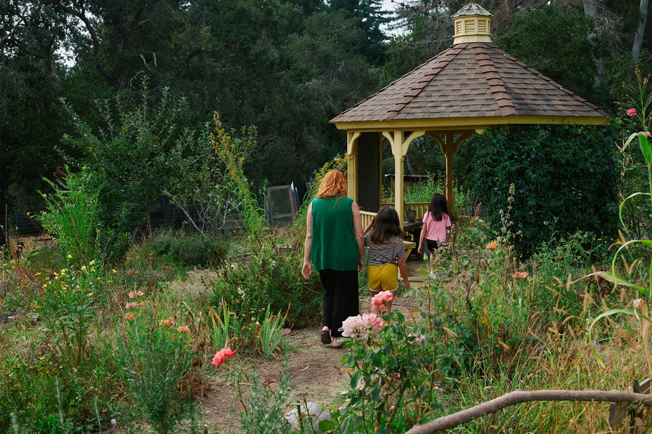 Chelsey and her children in the school garden