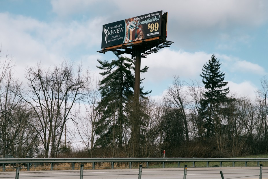 A billboard along the side of a highway