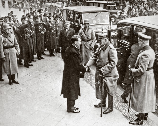 Hitler greets President Paul von Hindenberg in 1933.