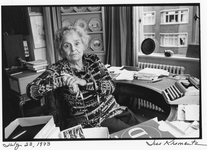 A photo of Rebecca West sitting at her desk in 1973, photographed by Jill Krementz