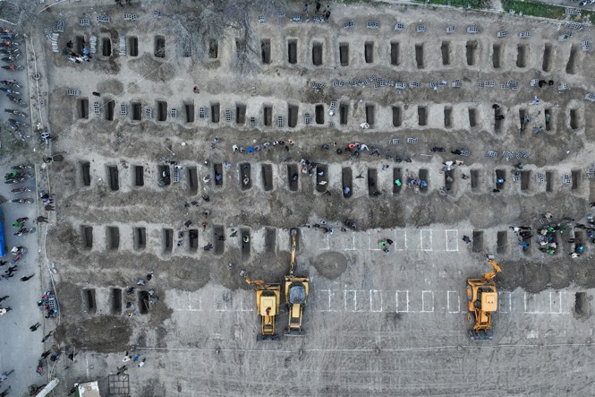 An aerial photo of graves being prepared 