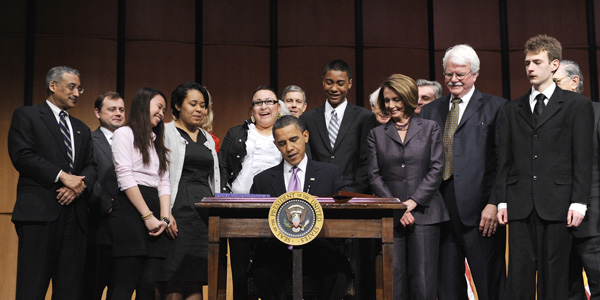 Obama signs health care - Reuters - banner.jpg