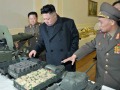 KJU with model tanks more on.jpg
