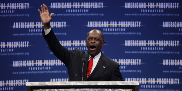 Herman Cain hand up AFP - Jason Reed Reuters - banner.jpg