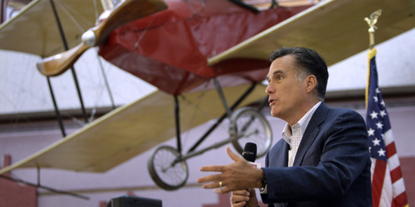 Mitt Romney speaking near plane - AP Photo:Charlie Neibergall - banner.jpg