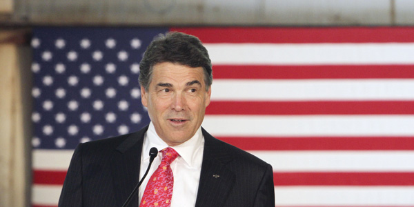 Rick Perry in front of flag - AP Photo:Jim Cole - banner.jpg