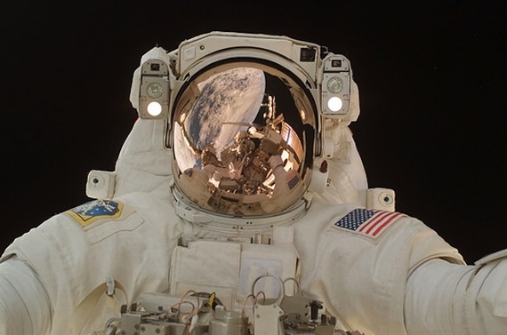 That's not just any astronaut on Navy's helmet, that's Navy royalty