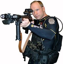 220px-Anders_Behring_Breivik_in_diving_suit_with_gun_(self_portrait).jpg