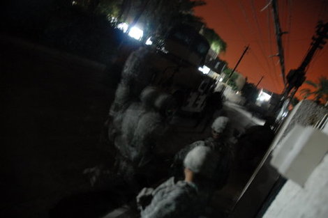 Soldiers_and_humvee_raid_night