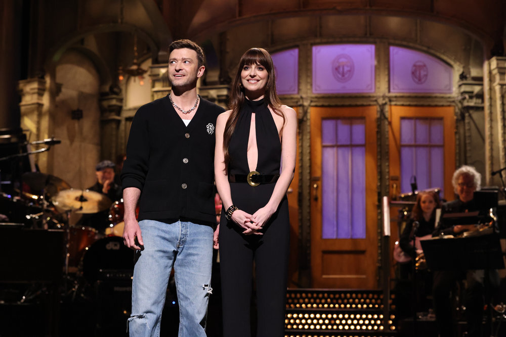 Justin Timberlake stands next to Dakota Johnson on the set of SNL
