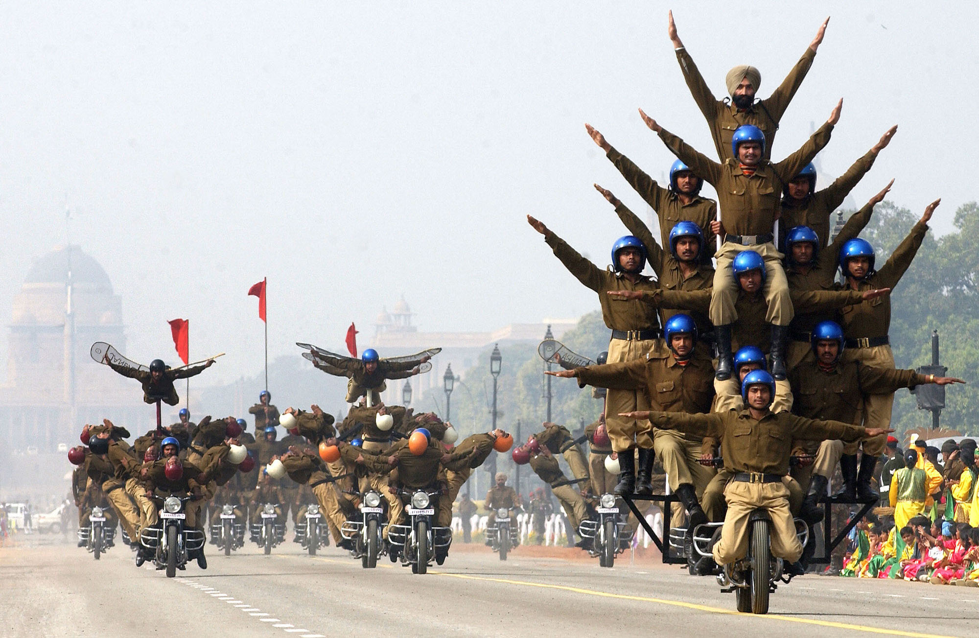 Indian Border Security Force personnel practice motorcycle formations as they take part in a 2006 Republic Day–parade rehearsal in New Delhi