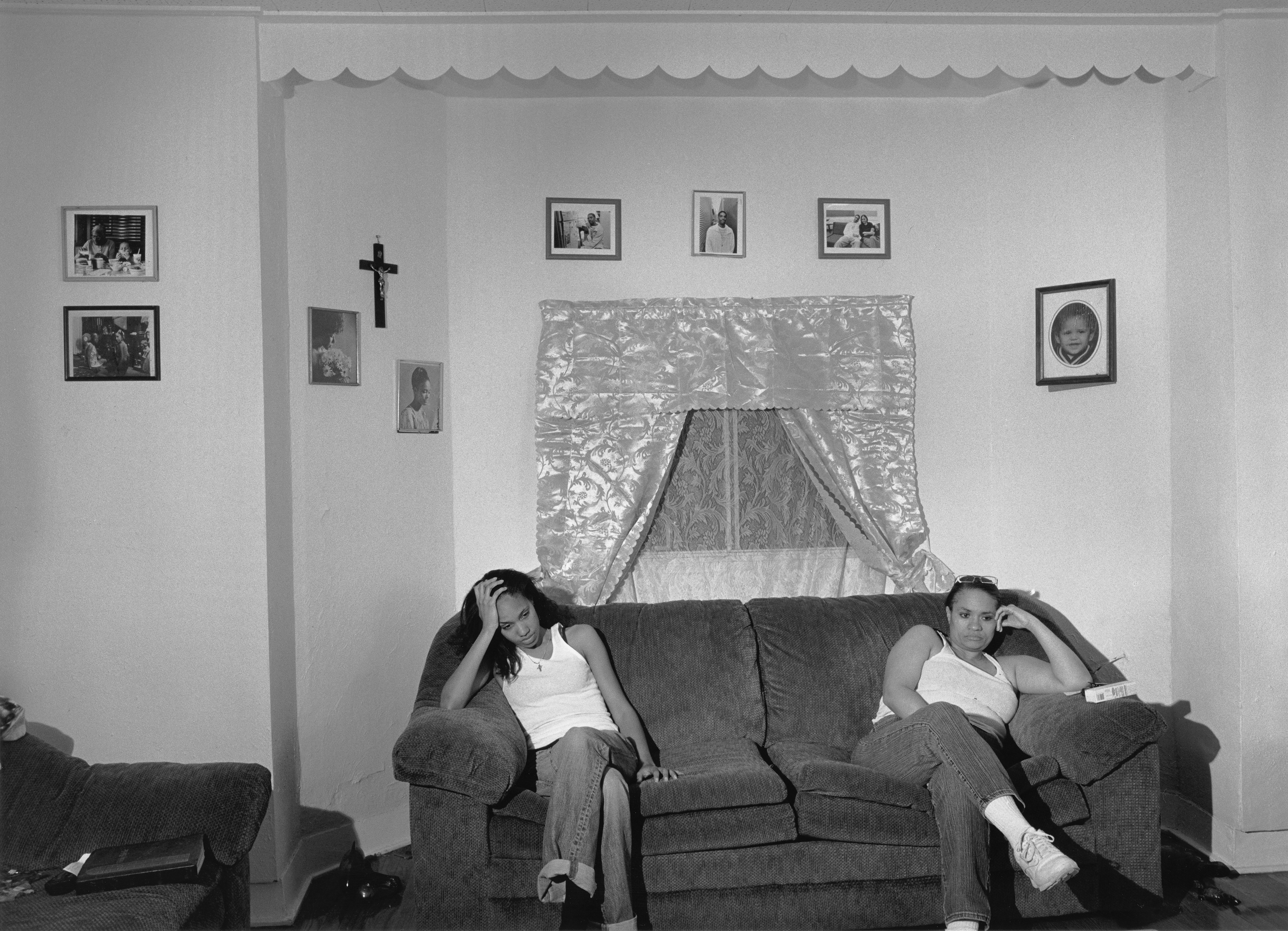 LaToya Ruby Frazier and her mom sit on a couch