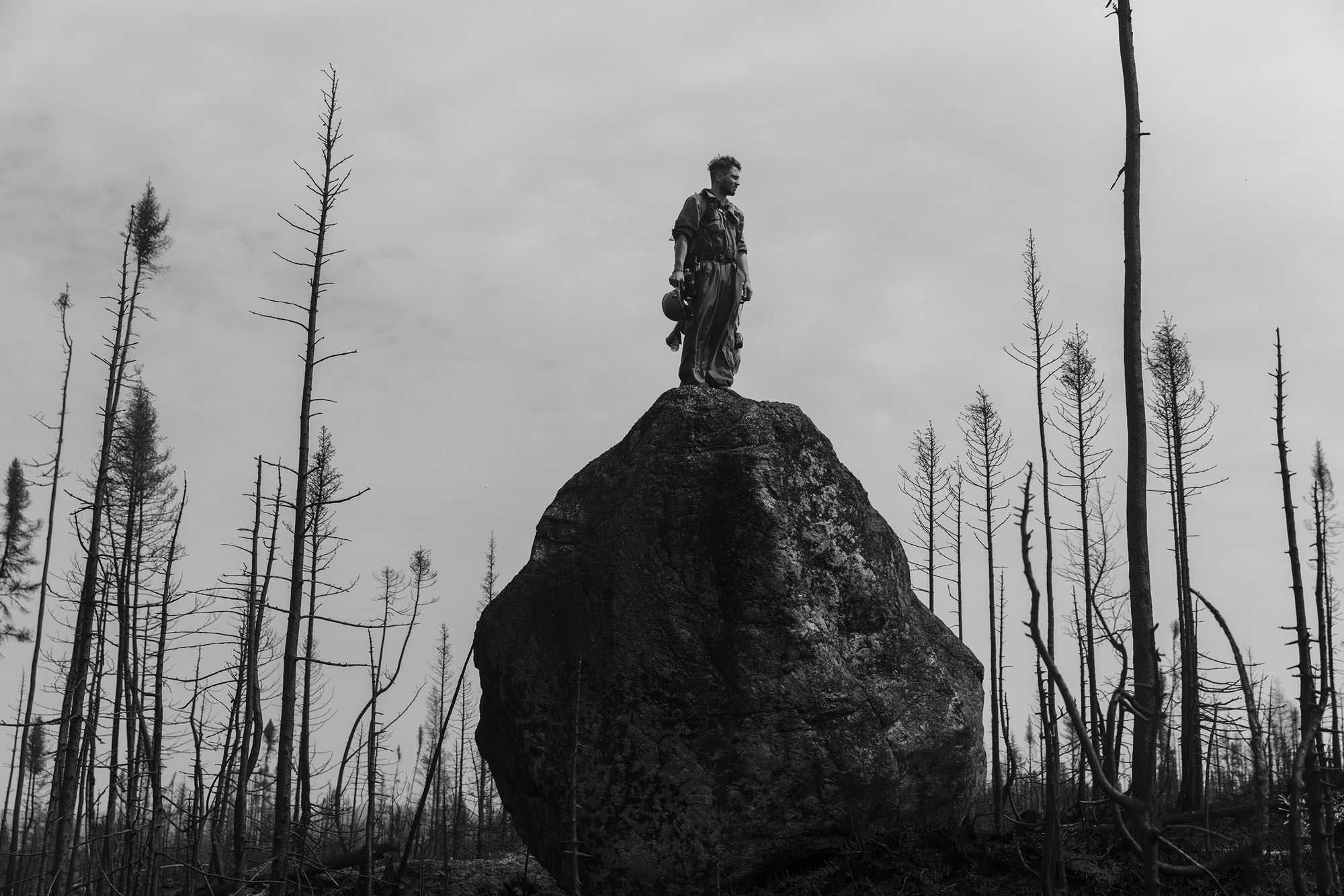 Theo Dagnaud, a member of a fire crew, scans the horizon during Canada’s recent summer of gigantic forest fires.