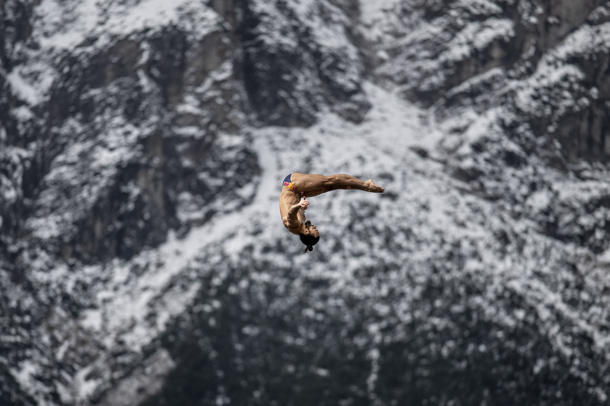 The Red Bull Cliff Diving athlete Catalin Preda, of Romania, dives from the 27-meter platform during a training session on September 14, 2024, in Tyrol, Austria.