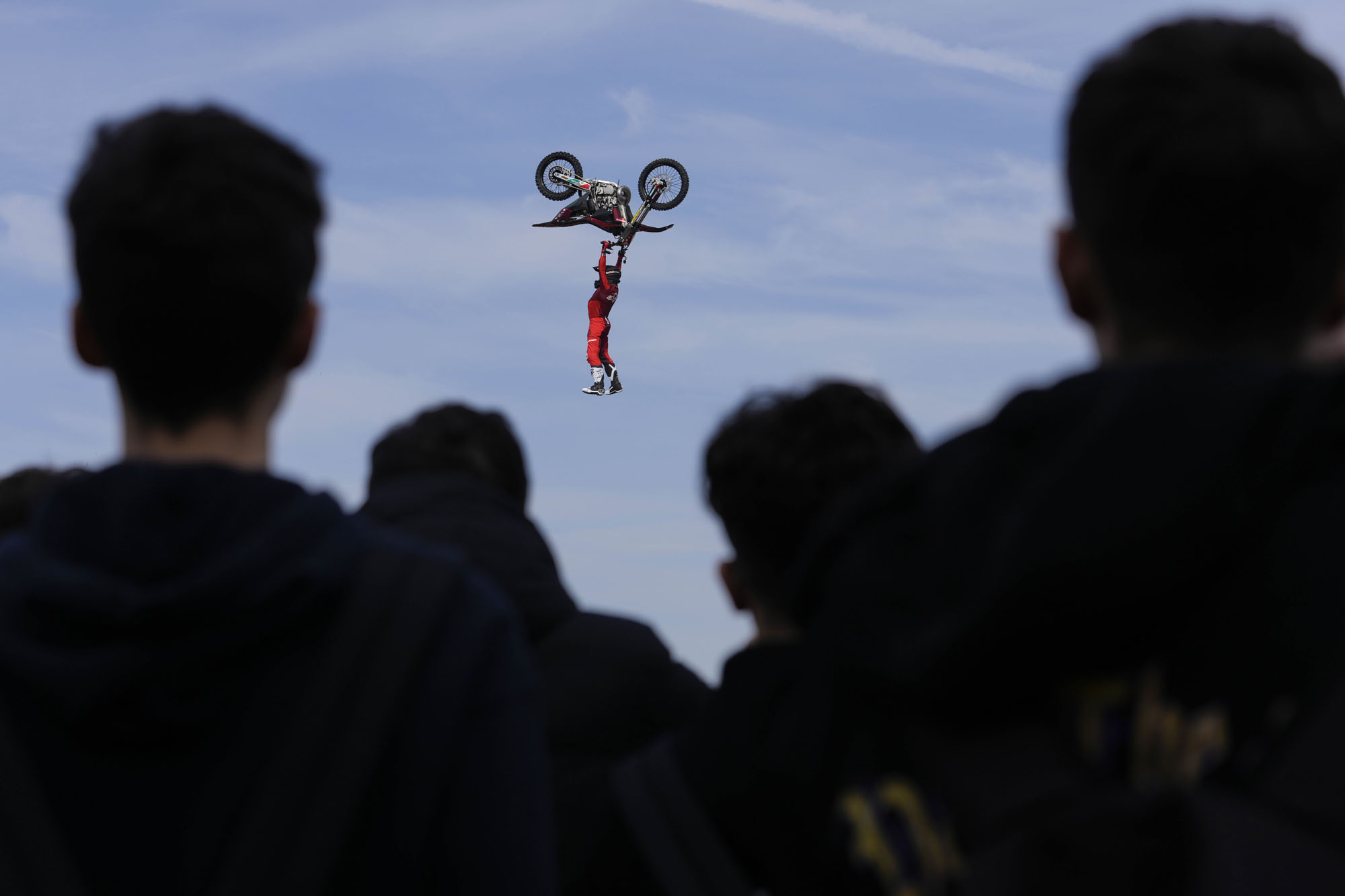 Riders perform during a freestyle motocross show at the EICMA exhibition motorcycle fair in Rho, Italy.