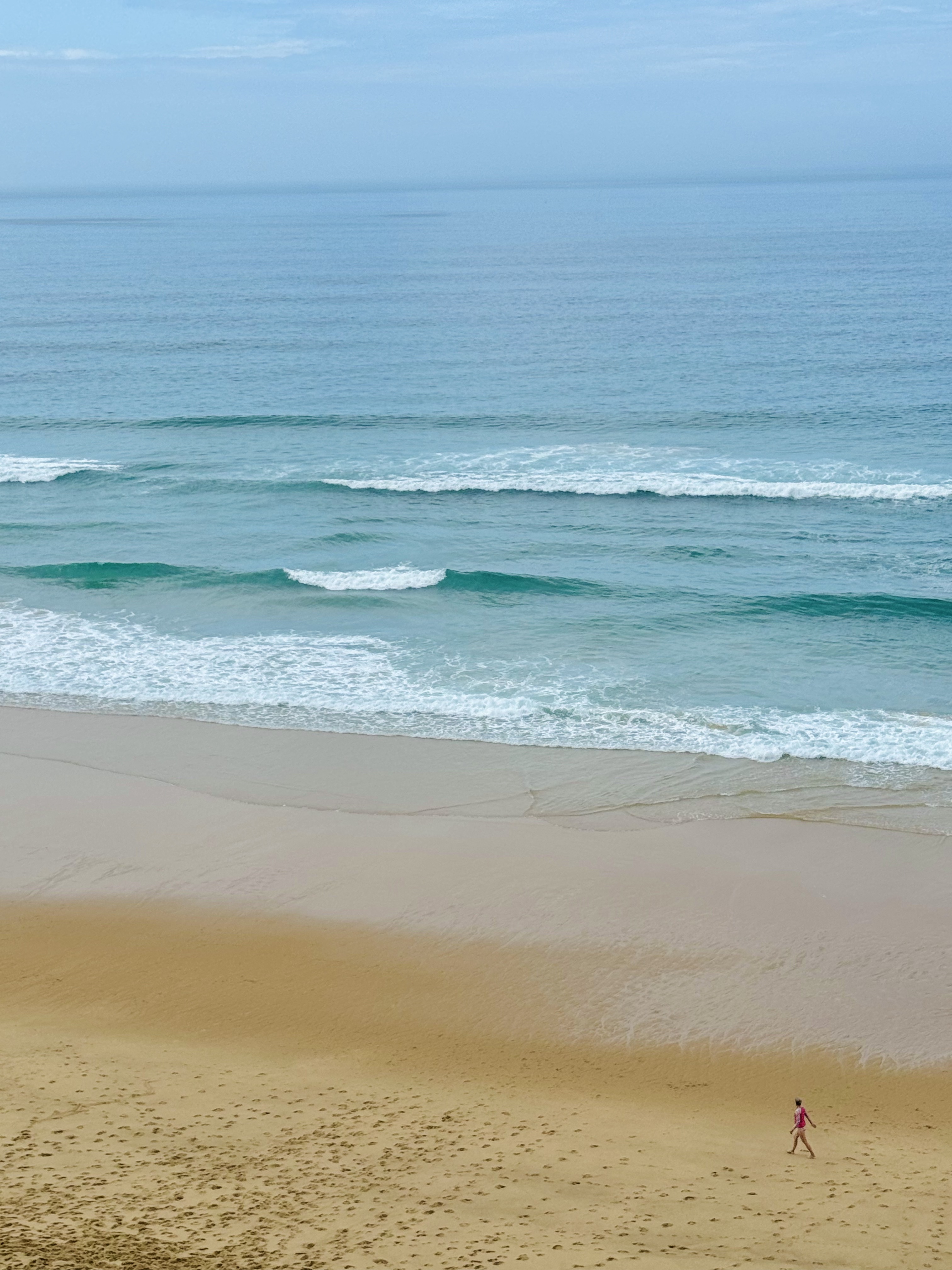 A person walking on a beach