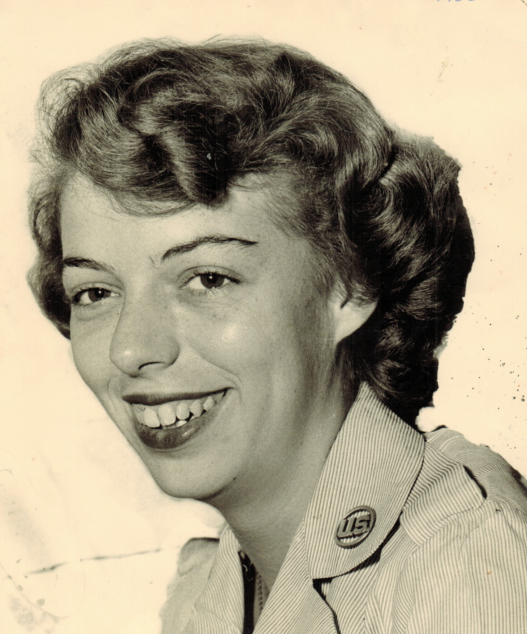 A photo of Tom's mother wearing a US button