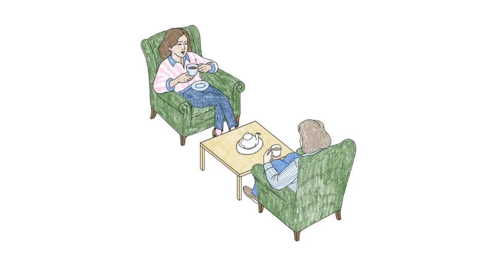 Two friends drinking coffee and chatting