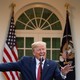 President Donald Trump pointing to the left during a coronavirus-task-force meeting in the Rose Garden