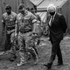 Boris Johnson walks alongside British troops.