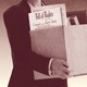 Illustration of a man in a suit holding a cardboard box with binders, folders, and the Bill of Rights