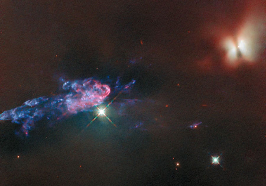 Two stellar structures seen in space, one shaped like a bright butterfly, the other, a colorful cloud of gas and dust.