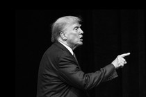 A black and white image of Donald Trump pointing