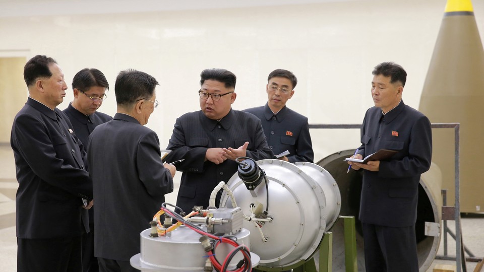 Kim Jong Un talks to his scientists 