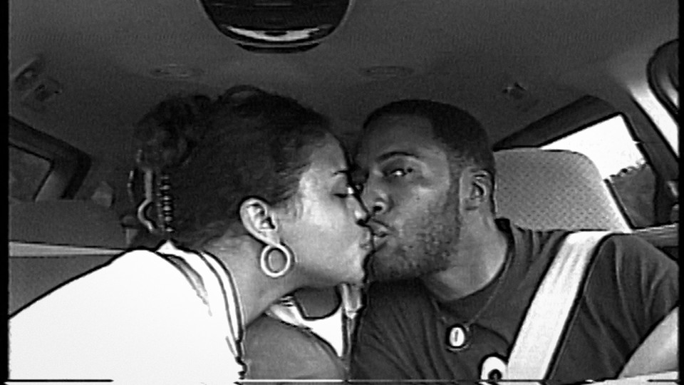 Rob and Sibil (Fox) Richardson share a kiss 20 years ago.