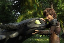 A still image of Toothless, a black dragon, and Hiccup, a Viking boy