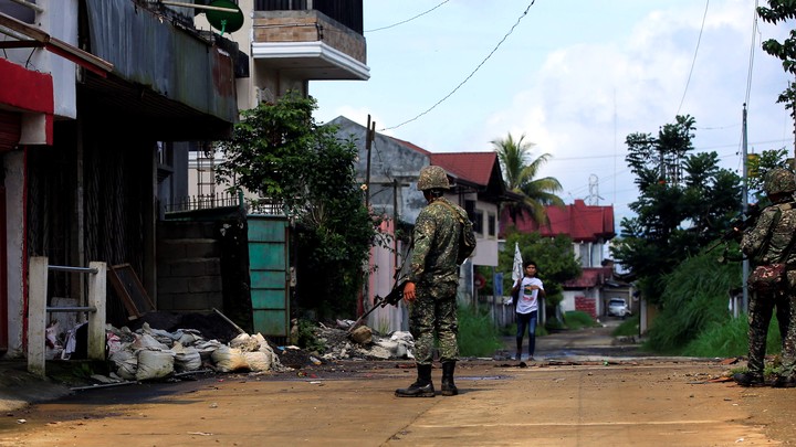 Government soldiers patrol Sarimanok village in Marawi City, which has been overrun by members of the Maute Islamist militant group, on June 1, 2017.