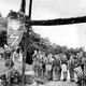 Nazi youths in uniform salute at the entrance to a German American Bund camp