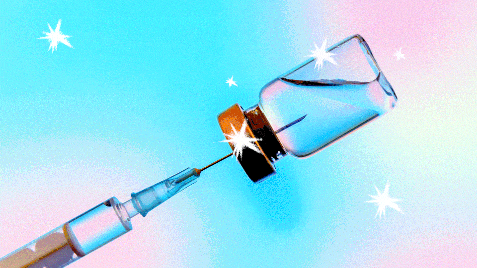 A needle drawing fluid from a vial, with sparkles