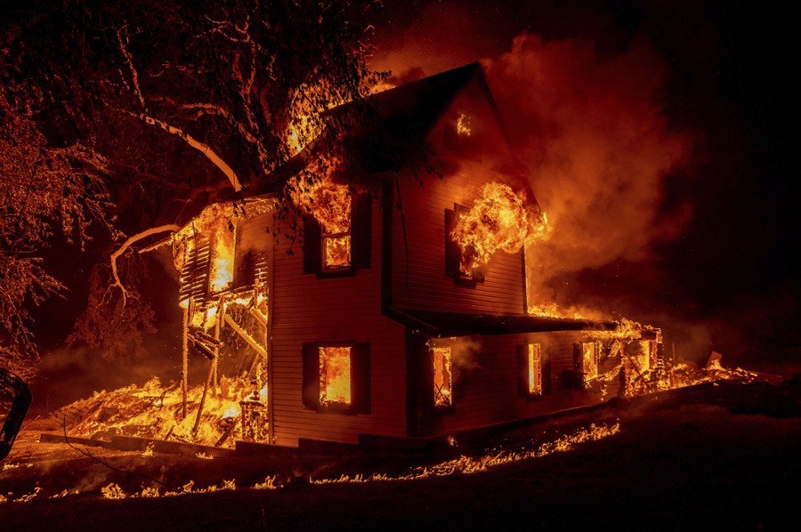 A house is consumed by a fire.